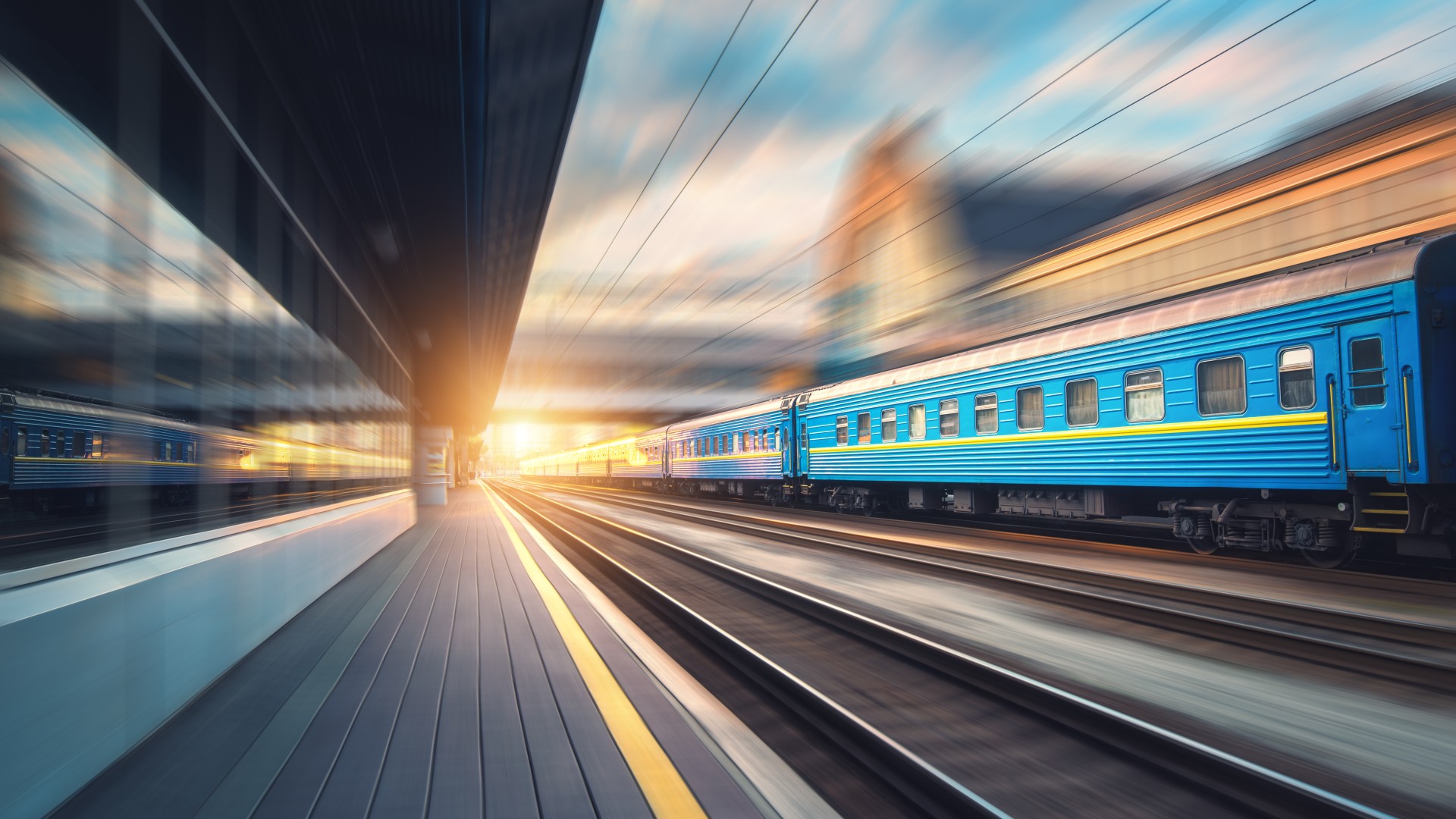 Fast moving blue passenger train